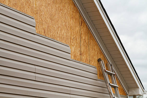 Professional Storm Damage Siding Repair technician working in Poplar Branch, NC